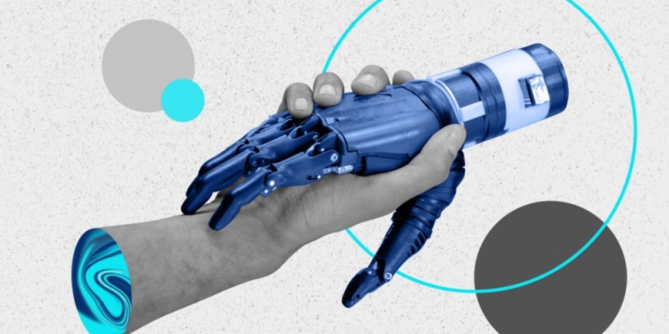 Um aperto de mão, sendo uma mão humana e outra de um robot